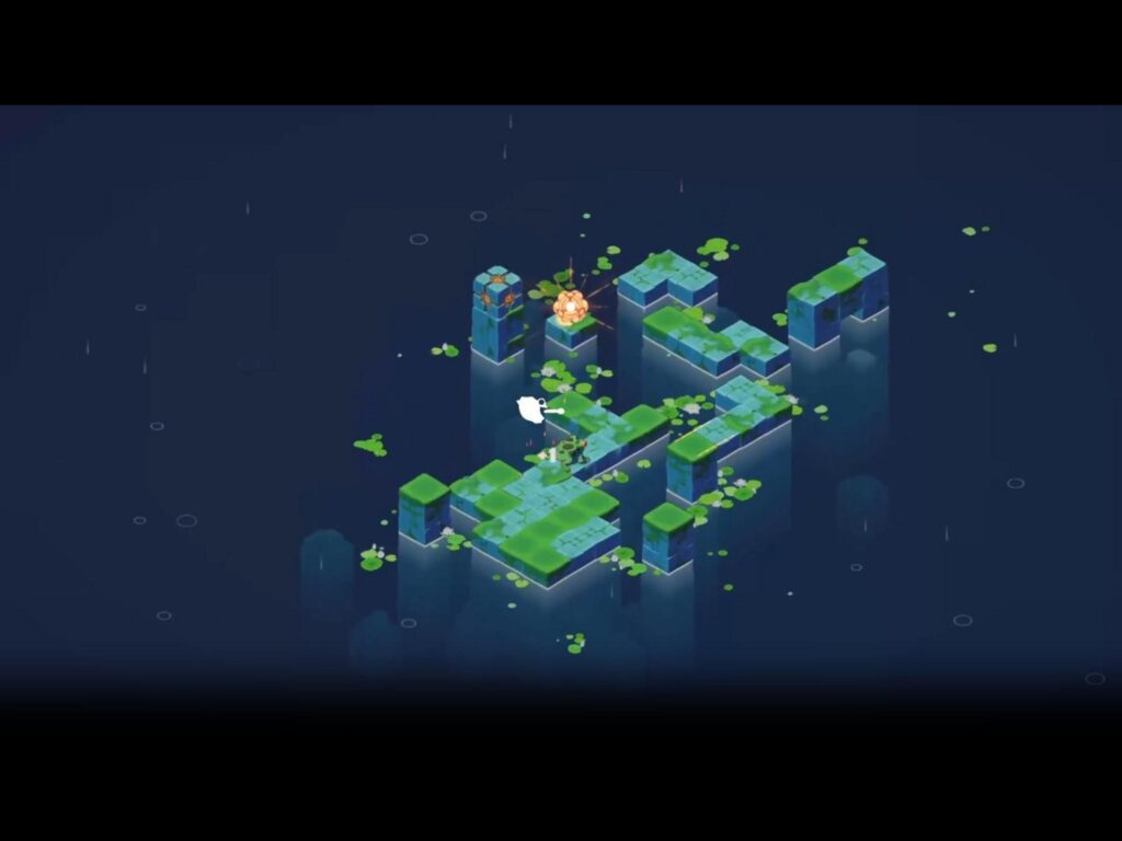 緑色のカエルがブロックを跳ねている